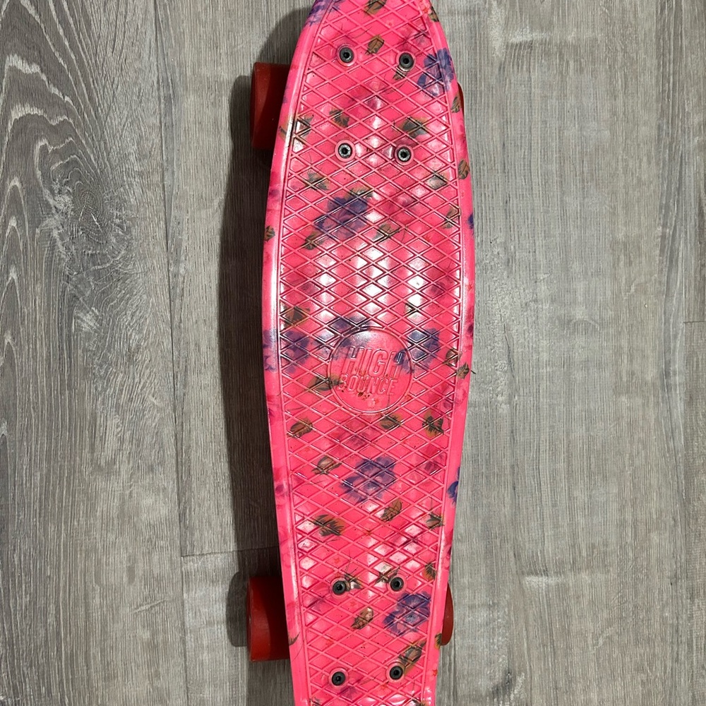 Bright Pink Skateboard with Floral Design